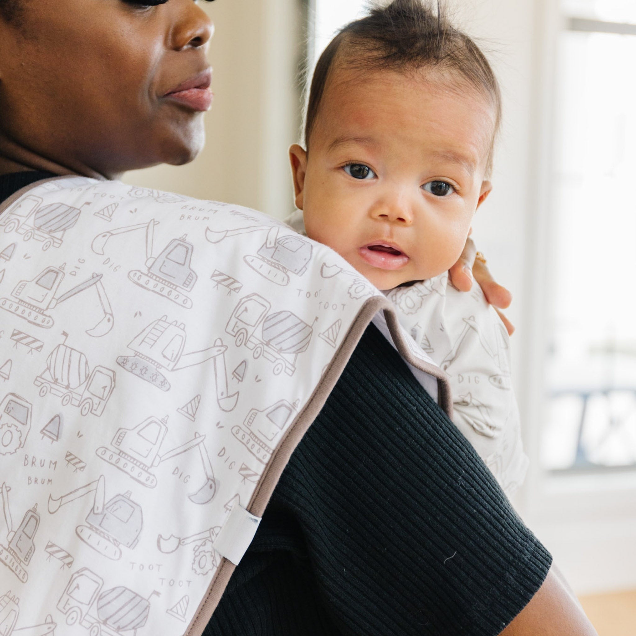 burp cloth with construction vehicles on it