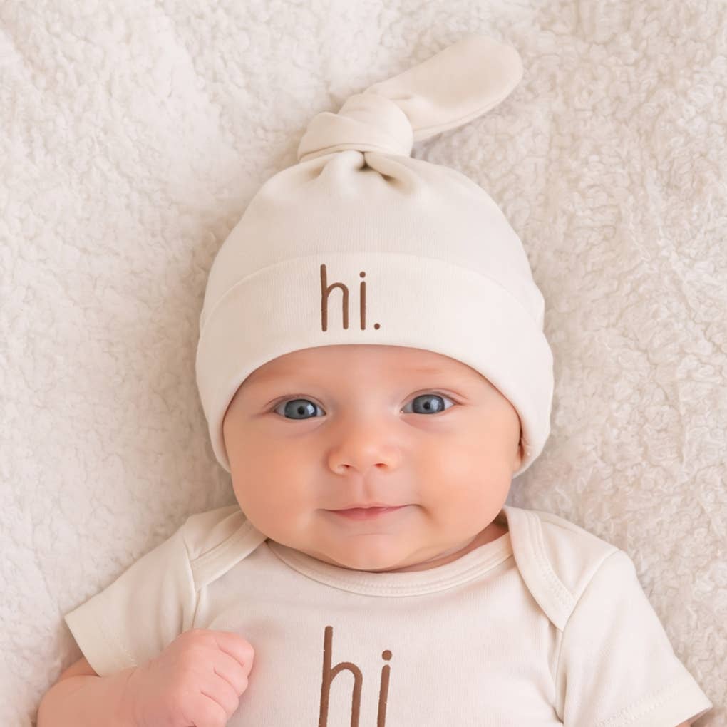 cream and brown knotted baby beanie