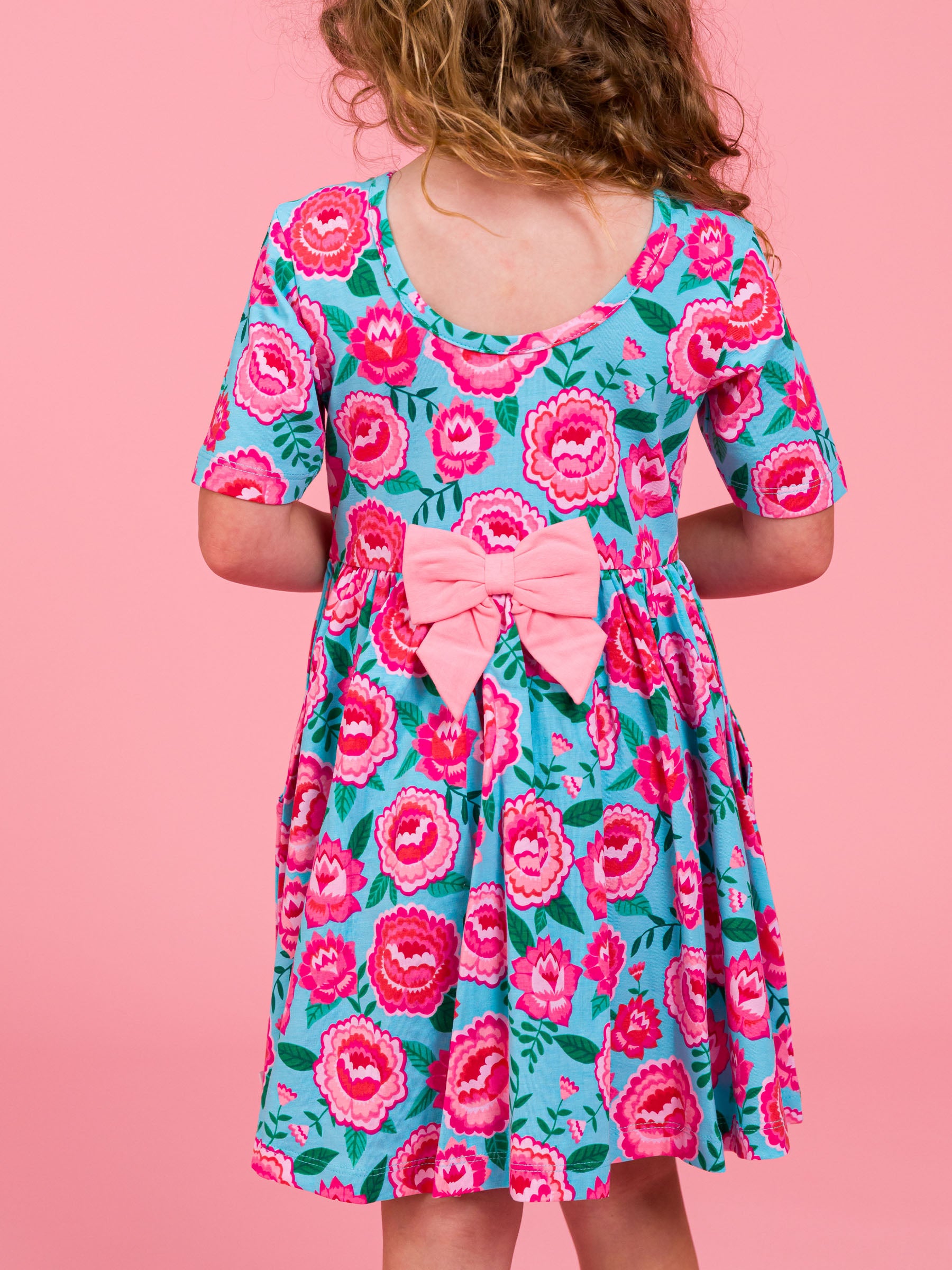 spring floral twirl dress with matching pink bow