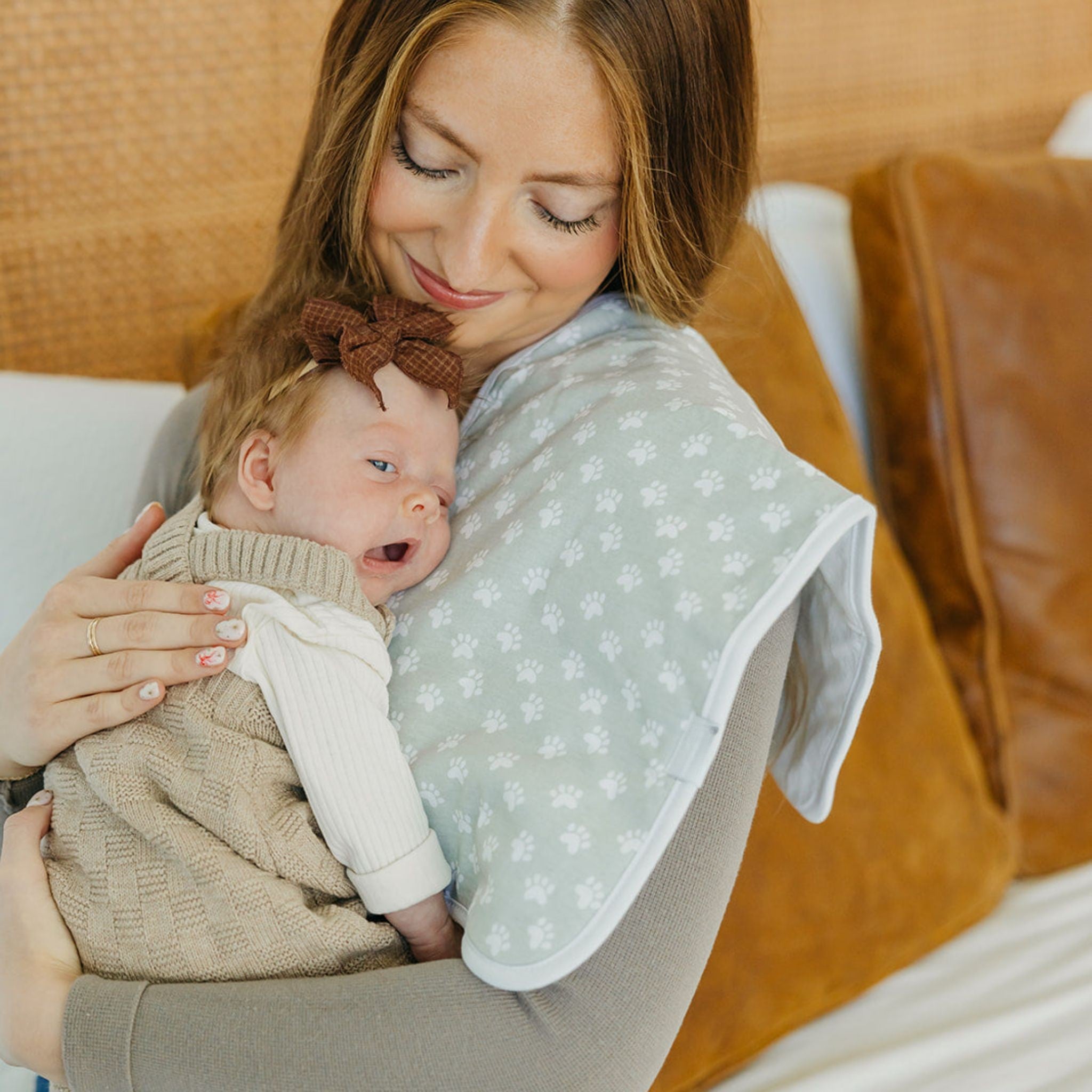 burp cloth with paw prints on it
