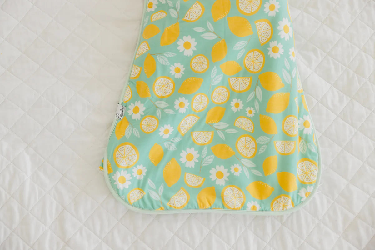 Cozy lemon-themed baby sleep sac in light blue