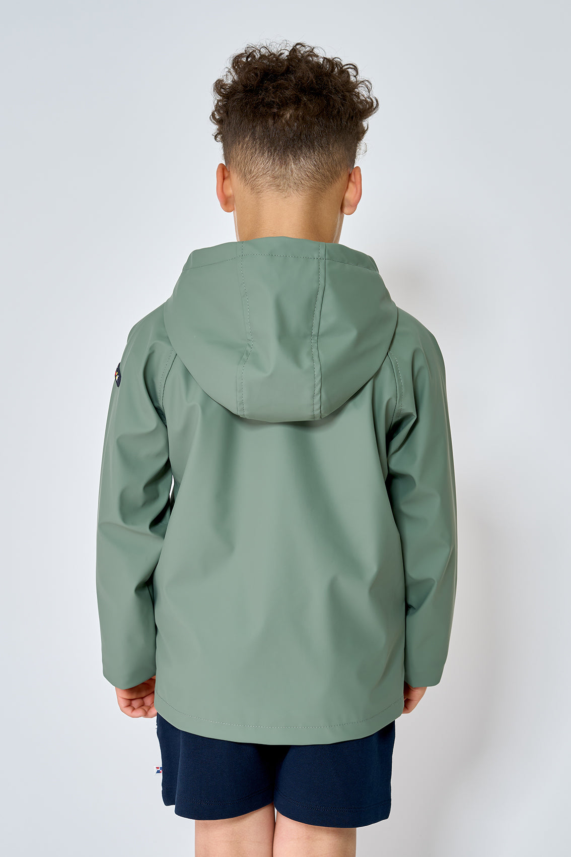 green kids raincoat back