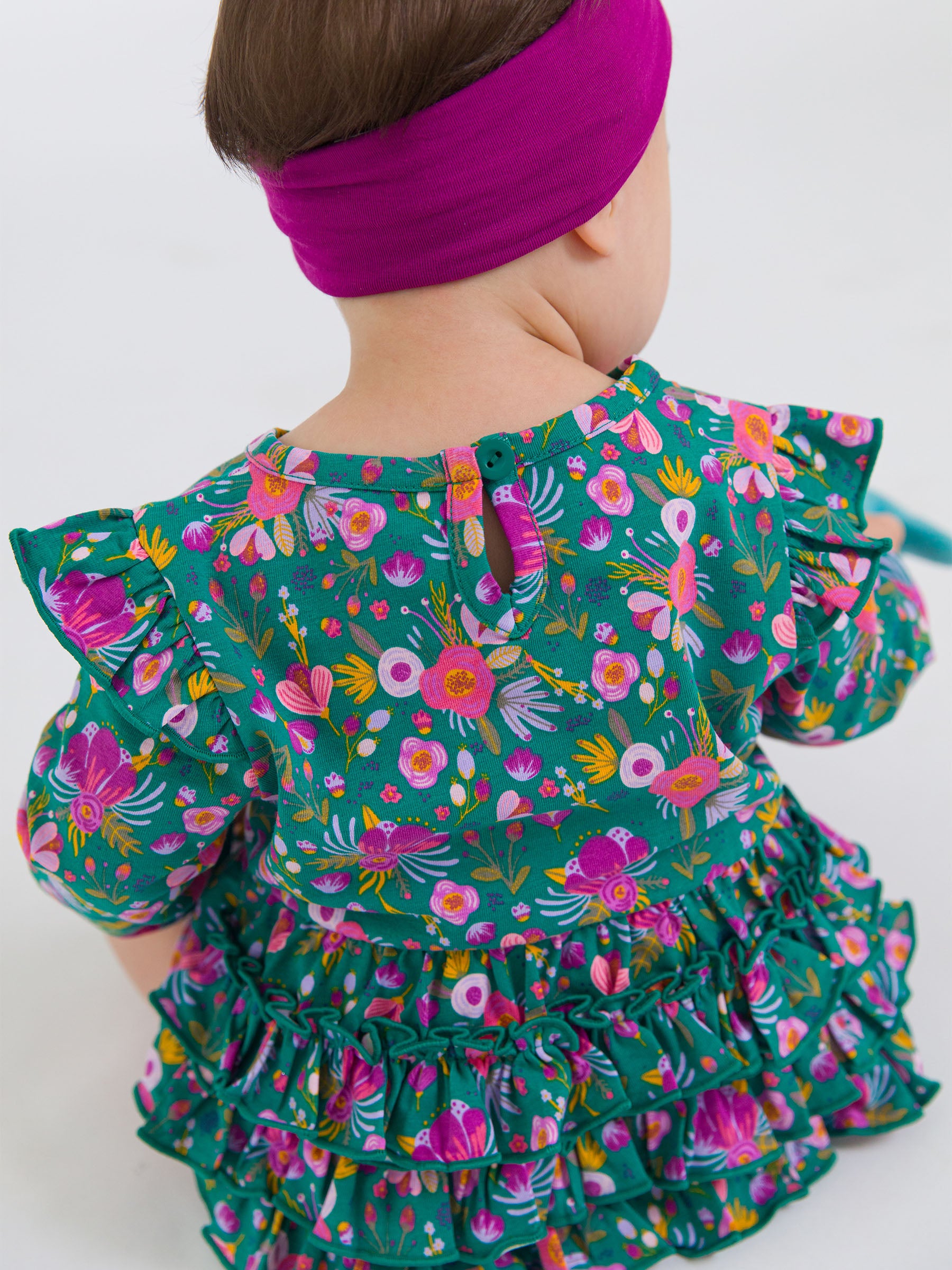 green floral baby bubble romper with keyhole back