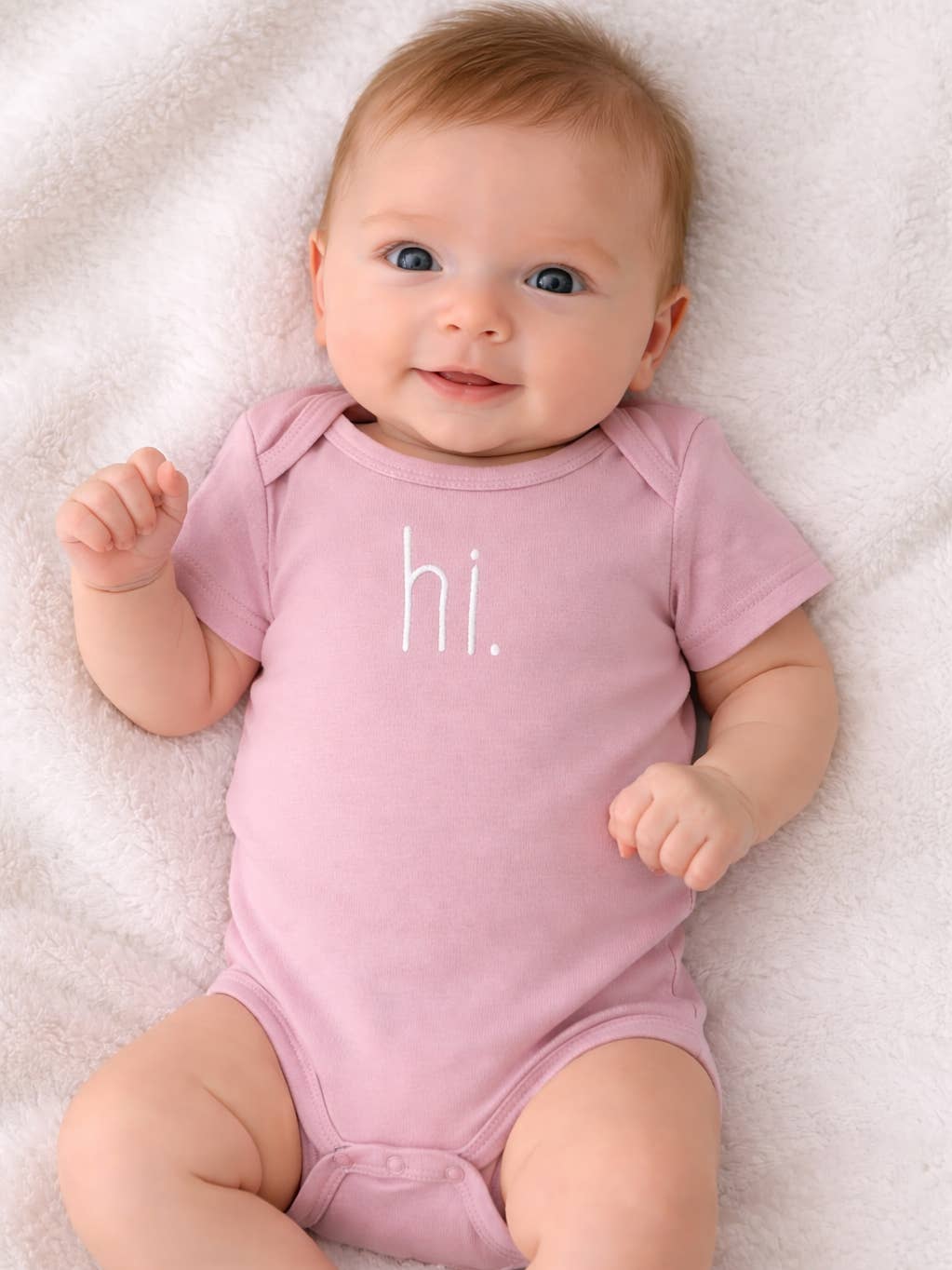 pink baby onesie with embroidery detail